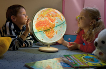 Kids Exploring Globe